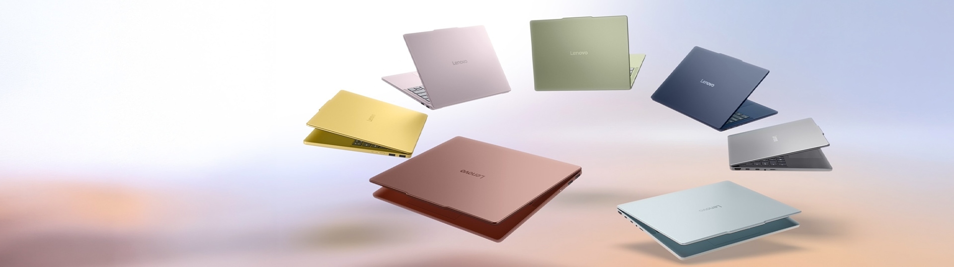 Seven slightly open Lenovo IdeaPad Vibe laptops arranged in a circle with their backs to one another, showing their array of colors: spicy gold, dreamy violet, zen green, moody blue, lowkey grey, chill blue, and radiant coral.